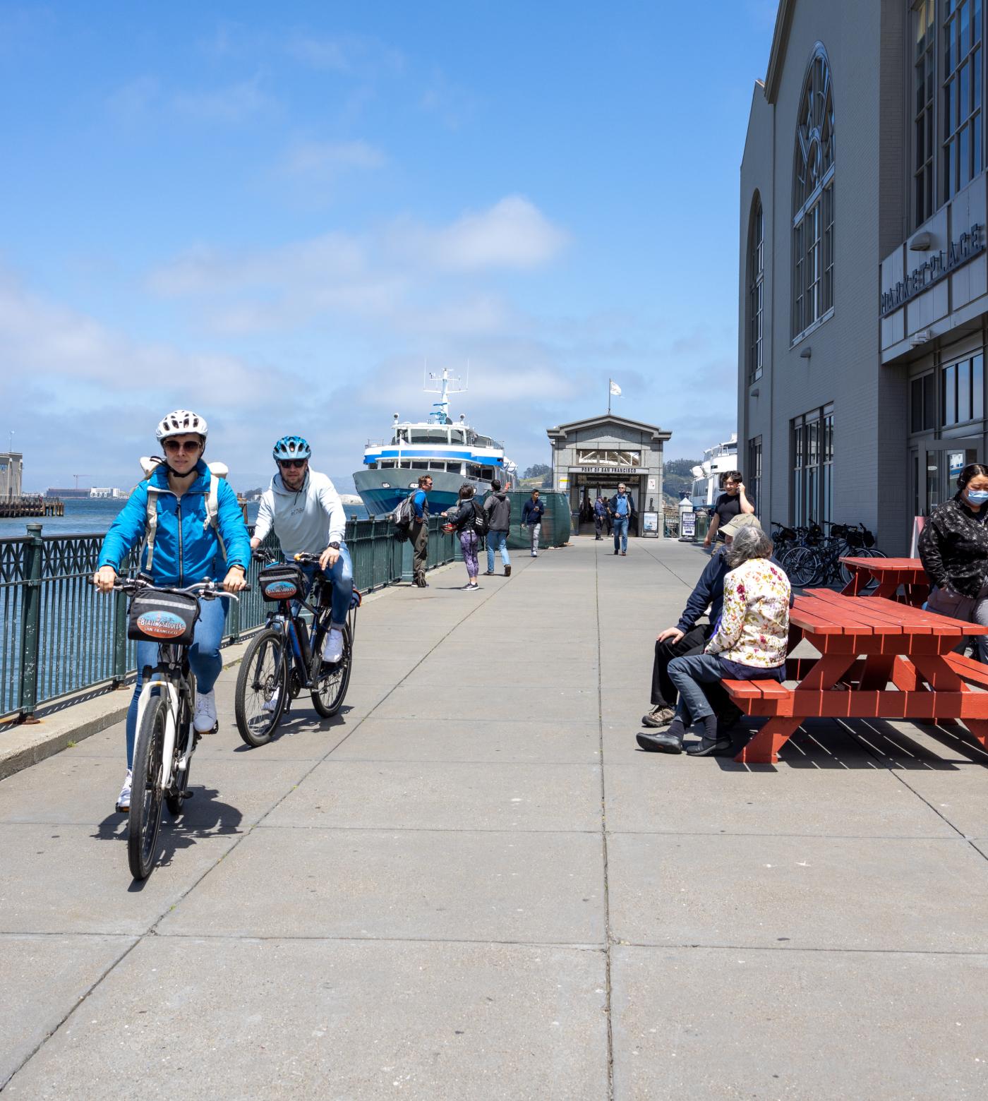 A view of cyclists riding down the Embarcadero.